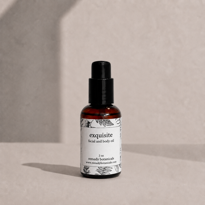 Exquisite in an amber plastic pump bottle on a soft beige background.