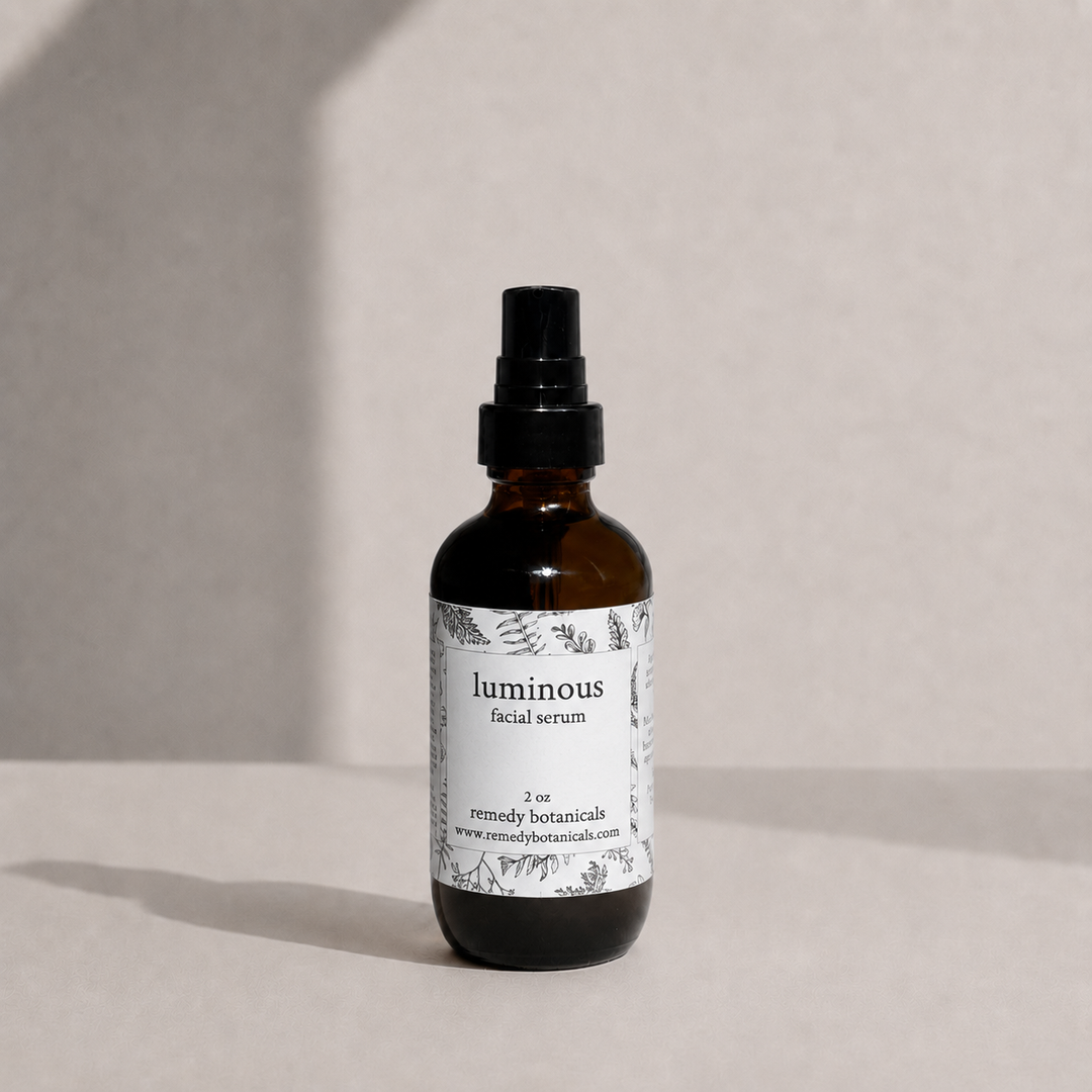An amber glass bottle of luminous on a soft beige background with natural light.