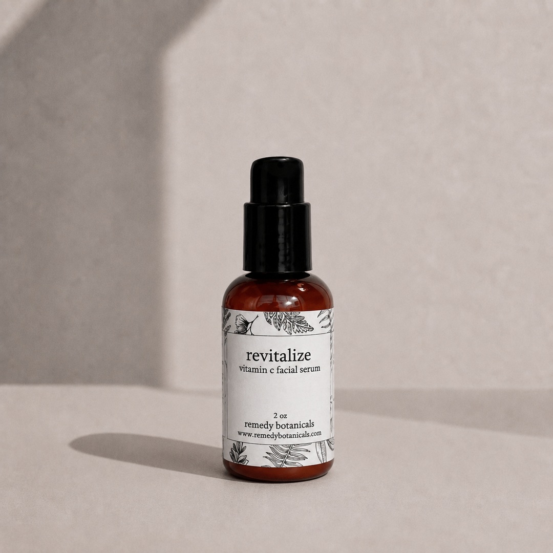 Revitalize in an amber plastic pump bottle on a soft beige background.